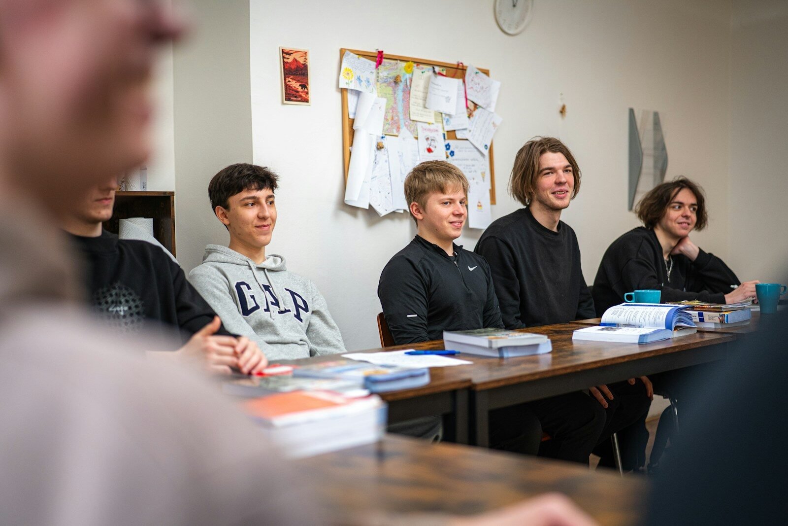 Students sitting at a table during a lesson